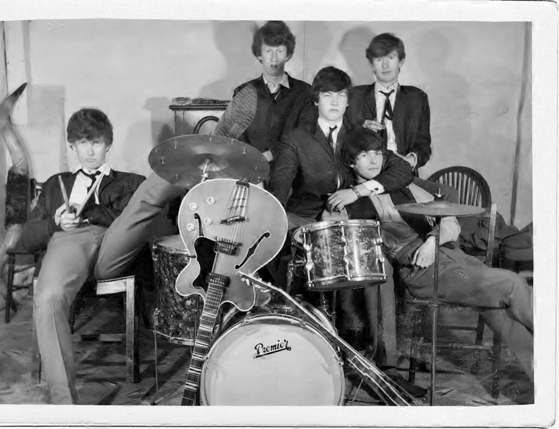The Breakaways in the 60s. Left to right: Bob Ellis, bass; Roger Cramp, lead guitar; Clive Davies, drums; Chris Easdown, lead singer (sitting slumped against Clive); Doug Toulson, rhythm guitar (behind Chris)