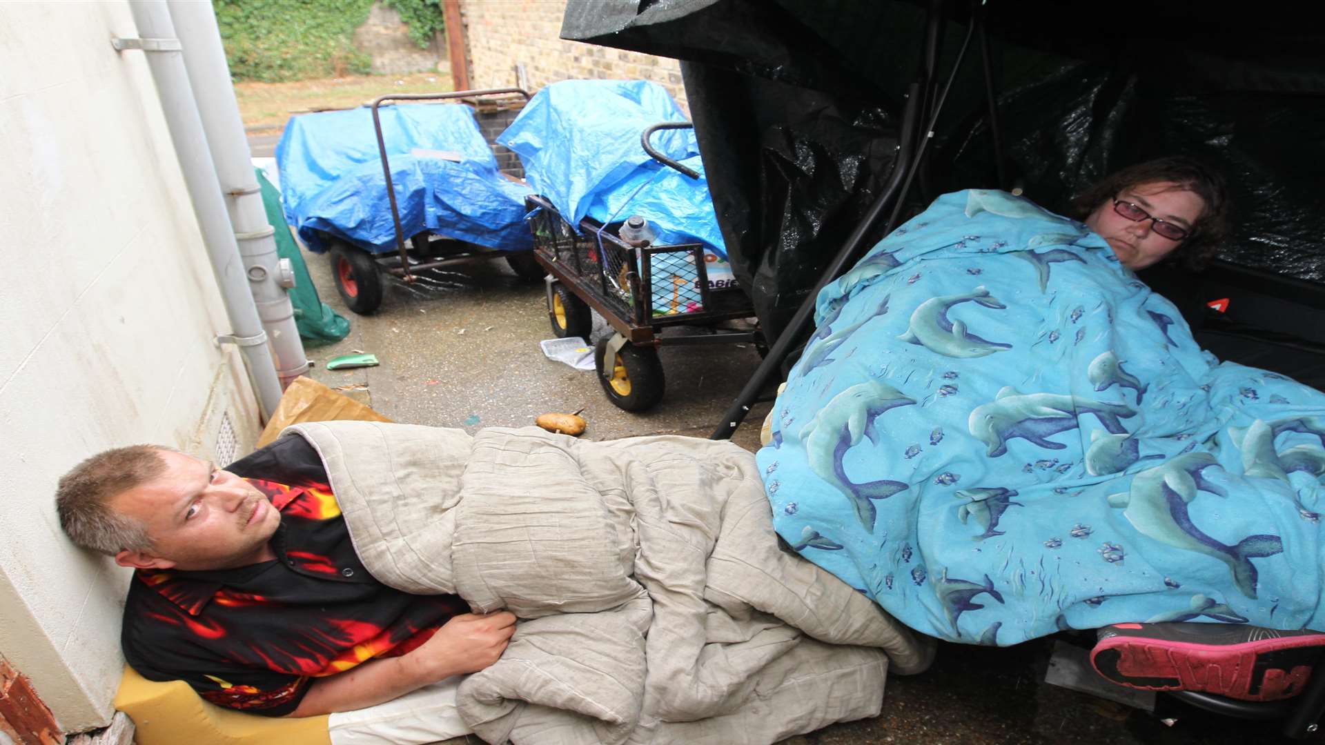 Paul Sargeant and his partner, Marina Wilks sleep outside to guard their property