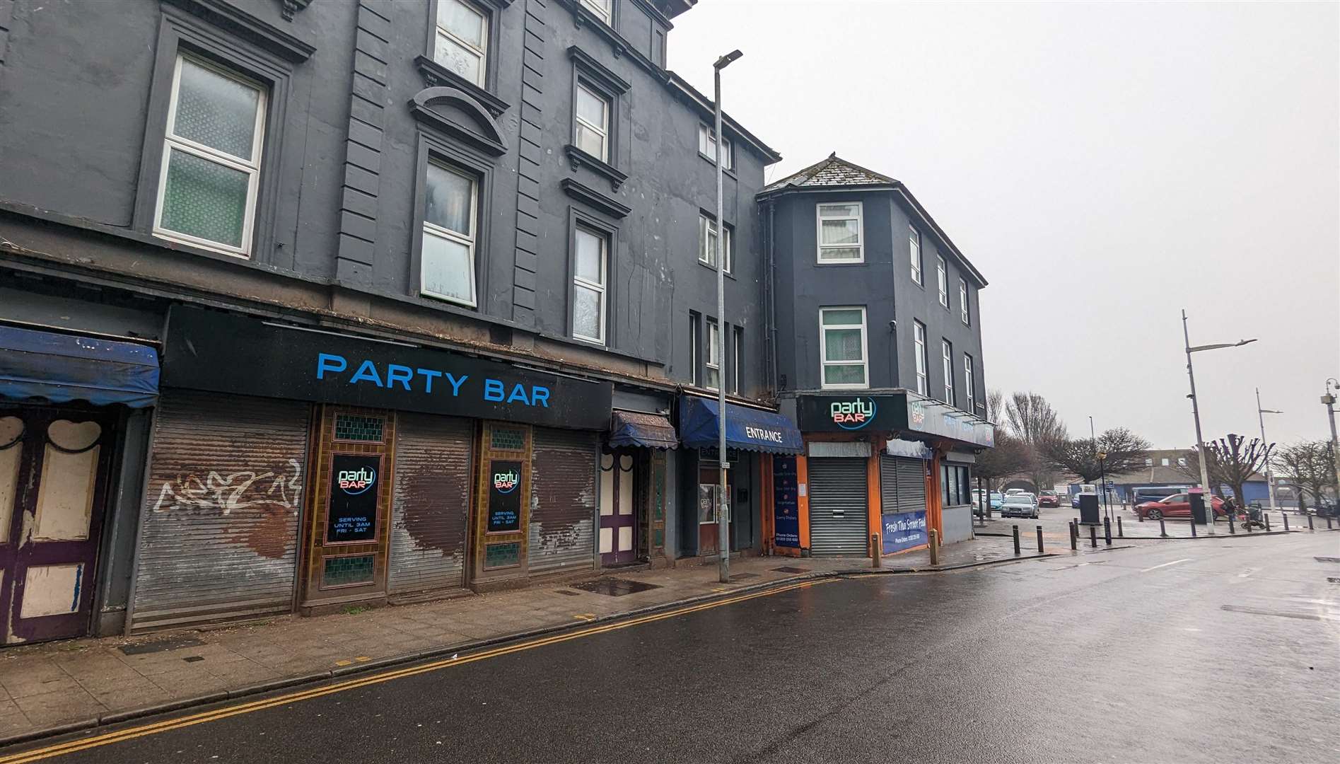 Shutters down at the Party Bar in Tontine Street on a grey weekday morning