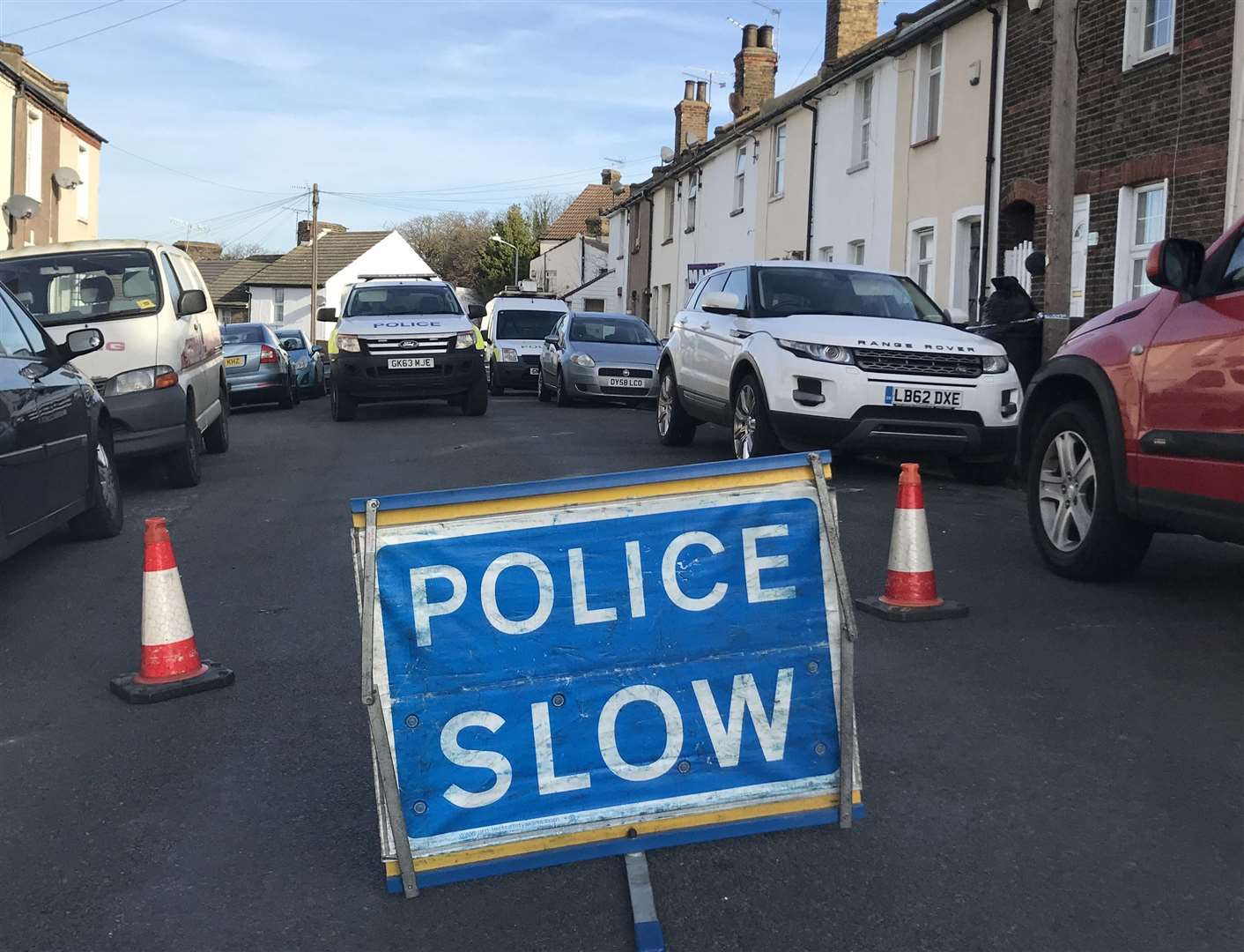 Police on the scene the day after a man was murdered in Hamerton Road, Northfleet