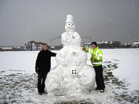 Martin and Jordan Frostick with their snowman