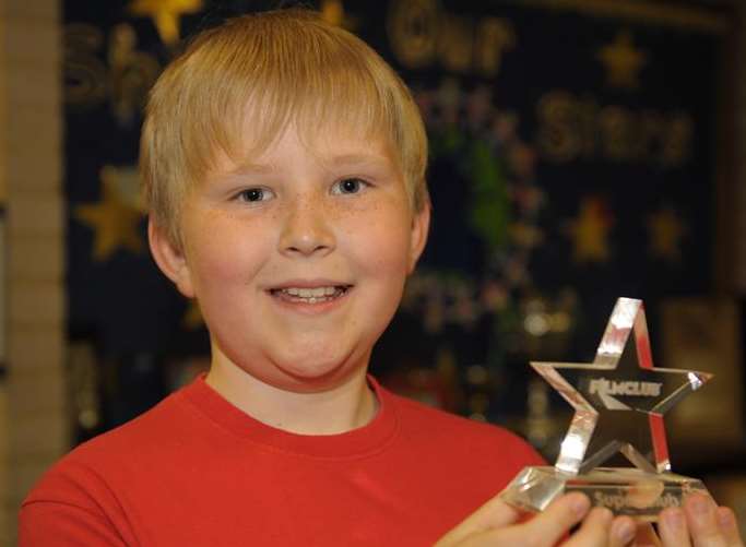 Joseph Fowler with his award at Eastchurch Primary School
