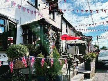 Bunting and flowers adorn The Butchers Block Pub in Burham. Picture Joanna Rickwood