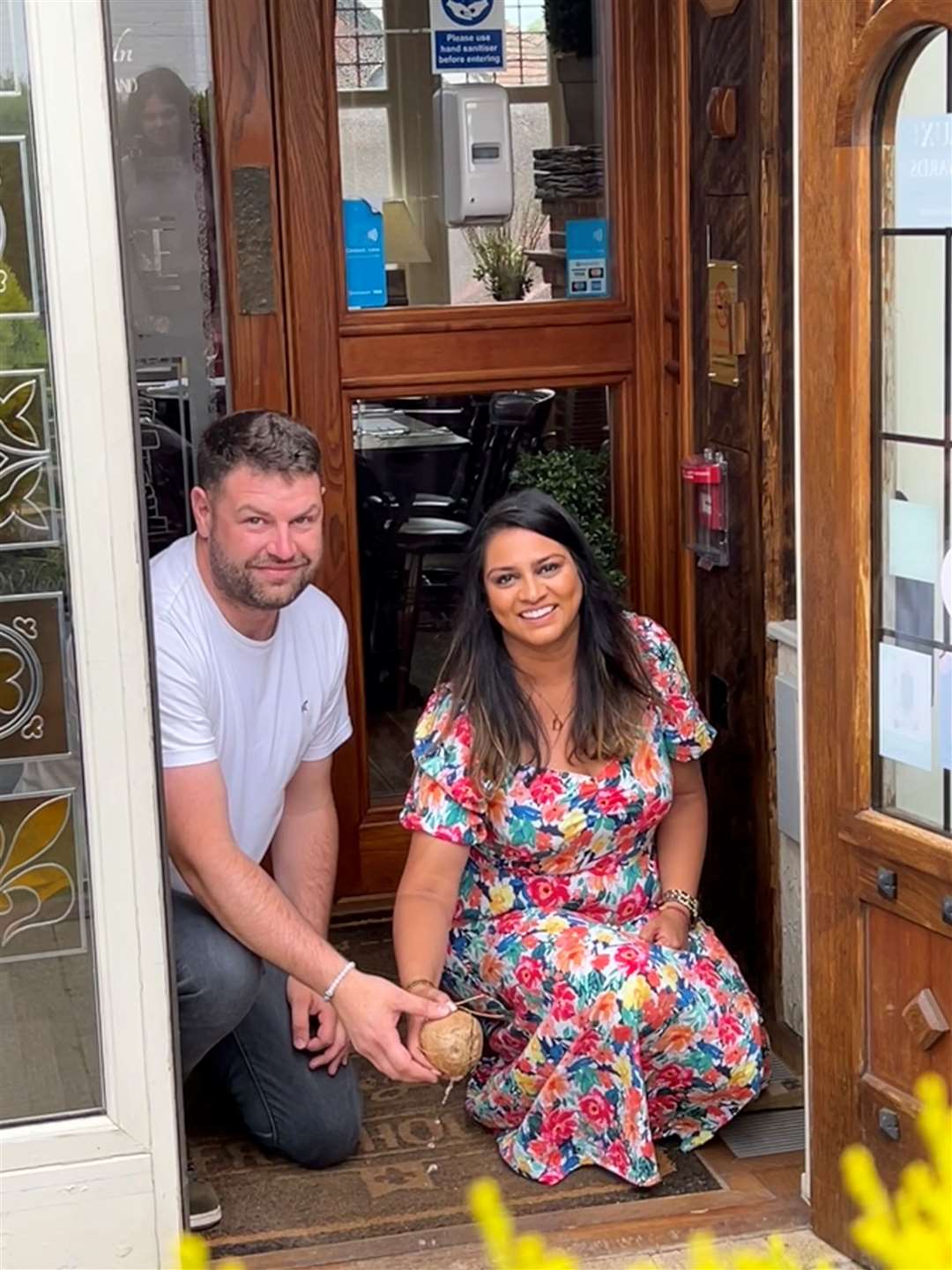 Dhvani Patel and Byron Hayter broke open a coconut over the threshold of The Tyler's Kiln for good luck in their new endeavour