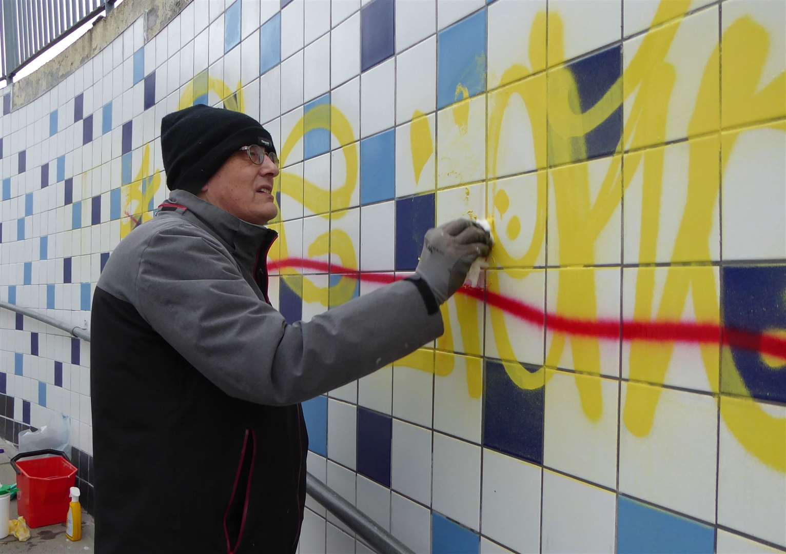 Derek Maslin helped clean the graffiti from new tiles in a Canterbury subway