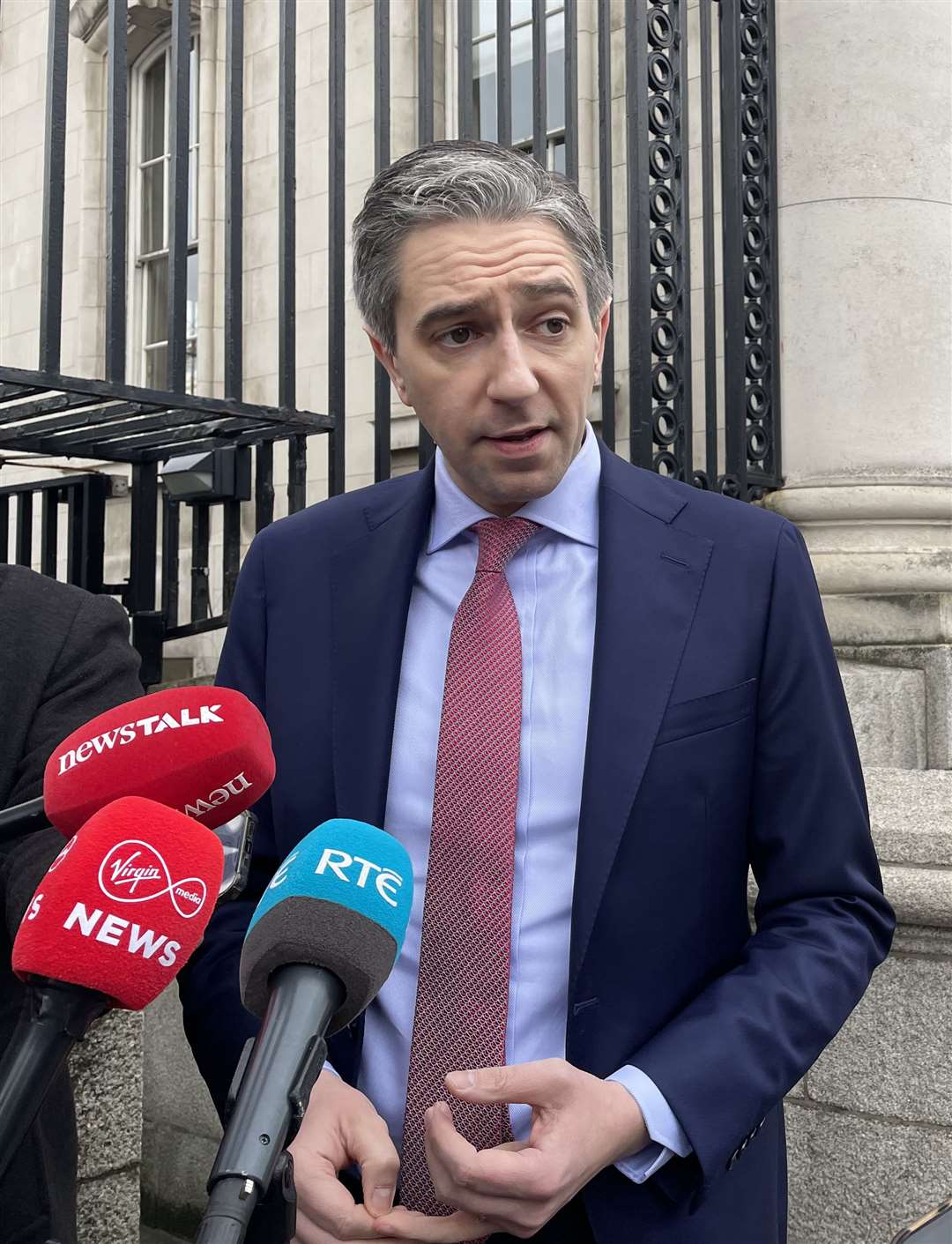 Simon Harris speaks to the media at Government Buildings, Dublin (Gráinne Ní Aodha/PA)