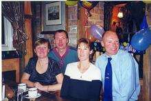 Tina Walker, Paul Wilkin, and Jackie Constant with brother Mark Wilkin at a family birthday meal.