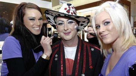 Amy Carter and Lacey Smith with Boy George lookalike Matt Endersby at the Mac make-up counter at Fenwicks Canterbury store on Friday.