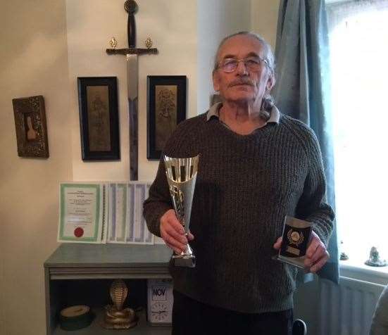 John Merner with his Southern Grip Masters trophy and overall Southern Grip Championship trophy.