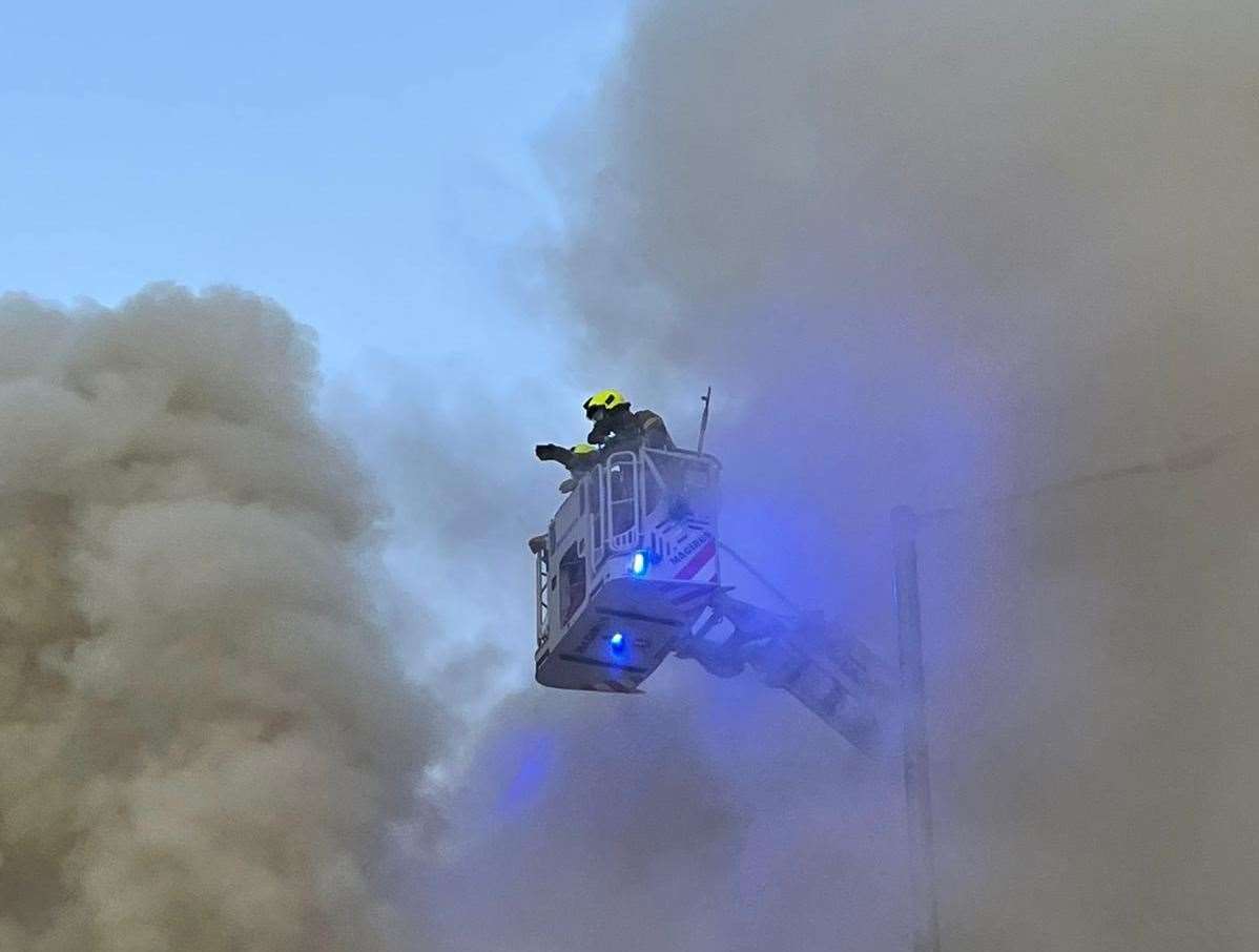 A firefighter tackles the flames in a height vehicle. Picture: Theresa Gower