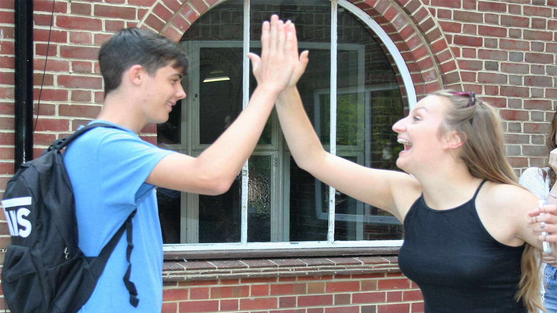 GCSE results prompt high fives for Ben Mynheer and Sophie Robertson. Picture: Mary Louis