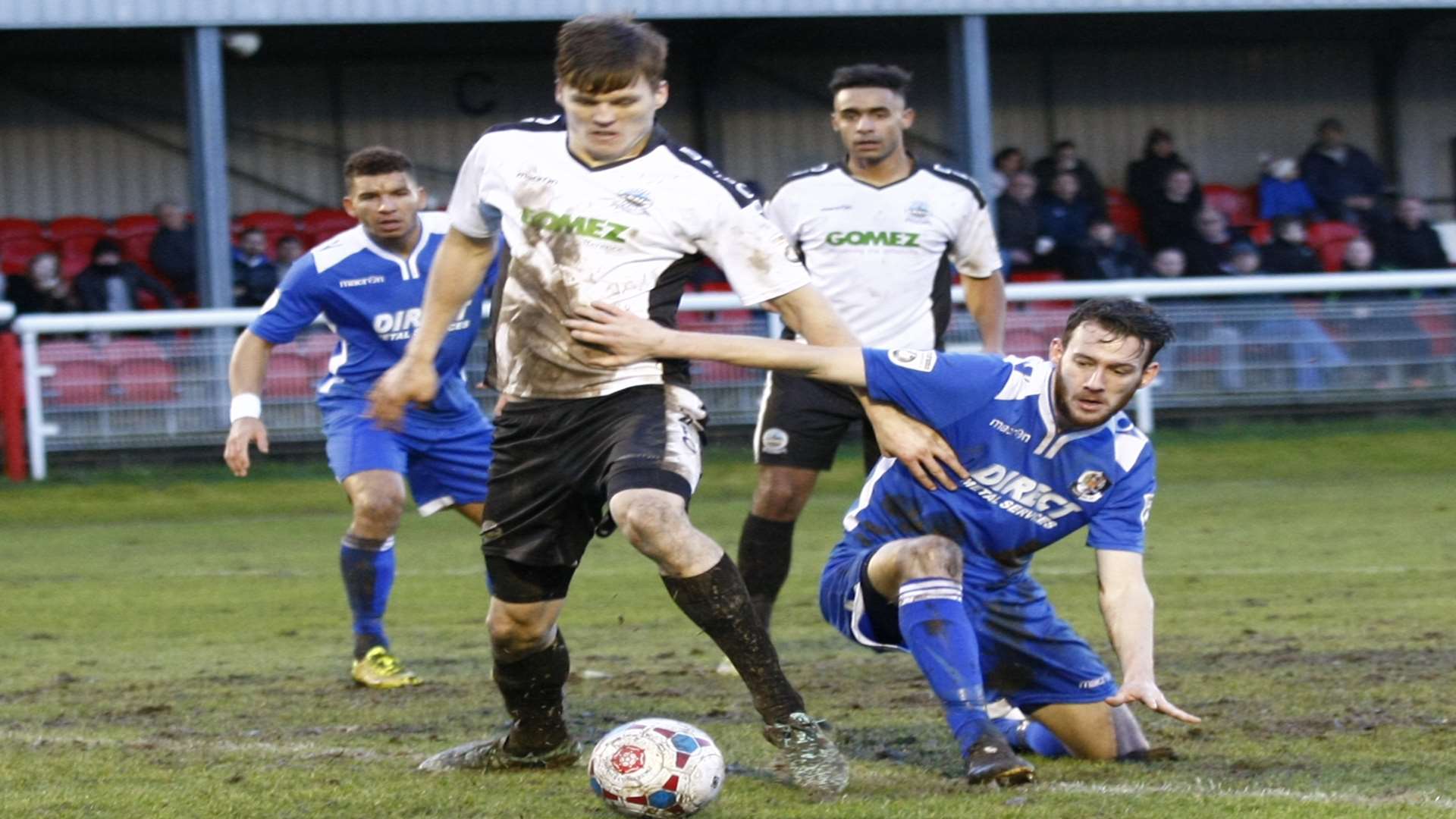 Sean Raggett in the thick of the action against Dartford earlier this season