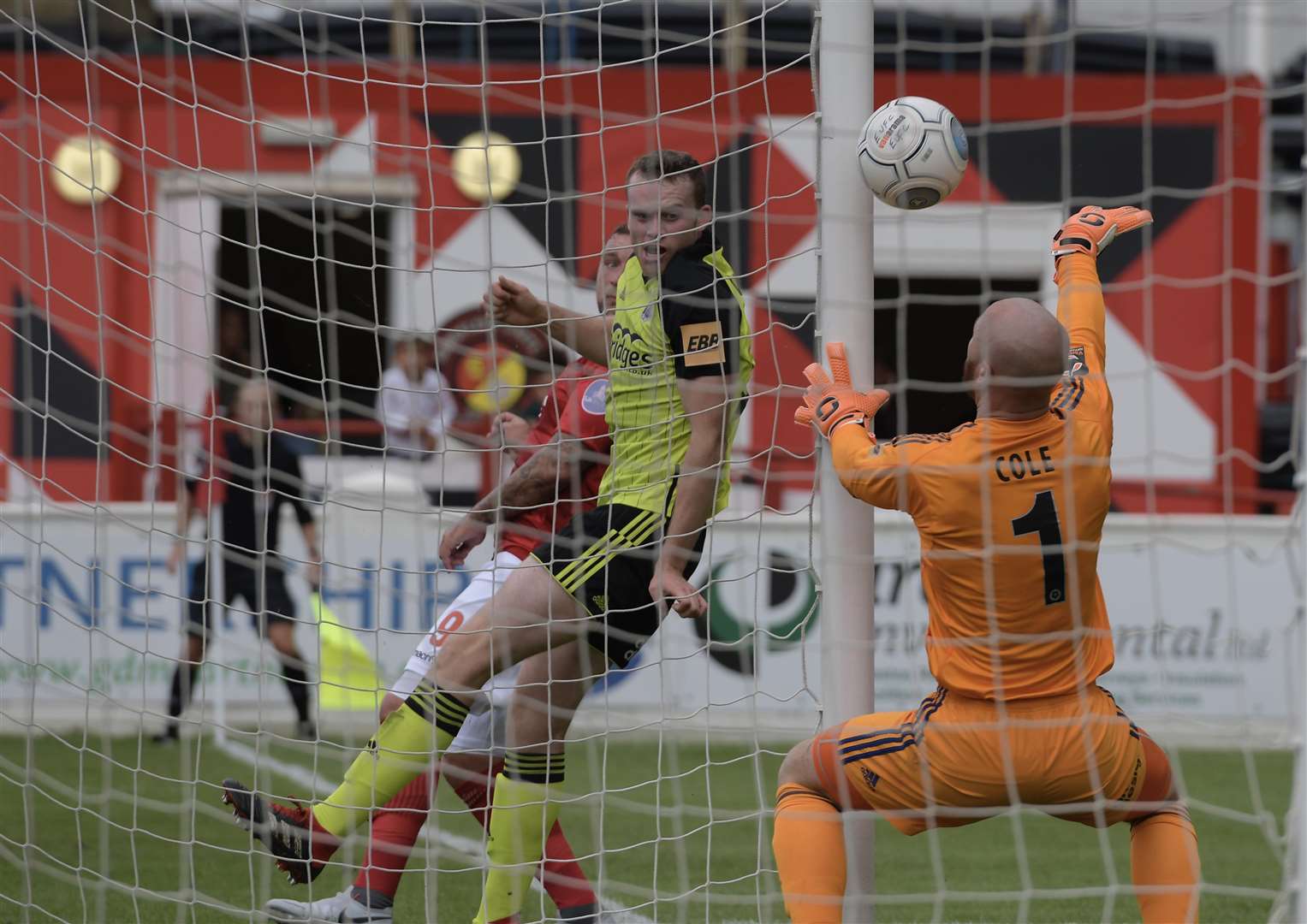 Goalkeeper Jake Cole desperately tries to keep Ebbsfleet at bay Picture: Andy Payton