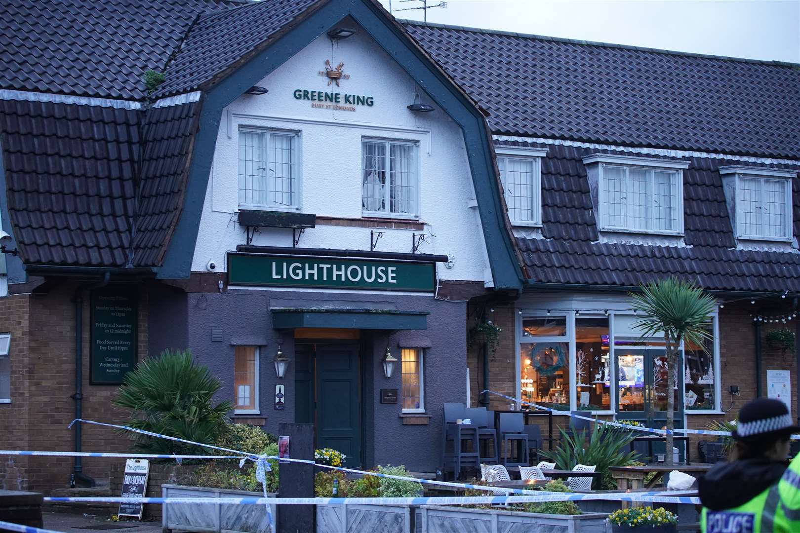 Police crime scene tape surrounds the Lighthouse Inn in Wallasey Village (Peter Byrne/PA)