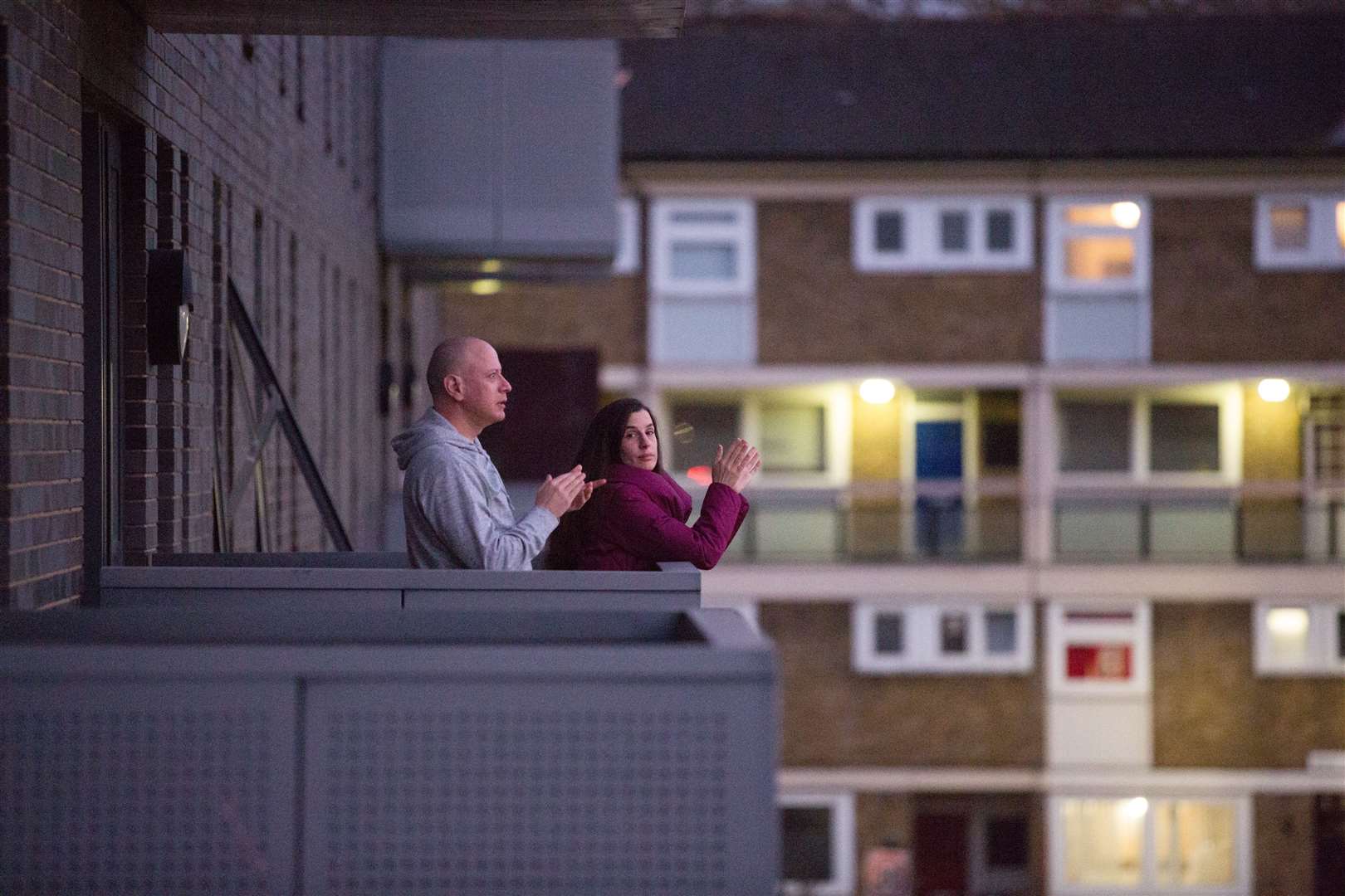 This image of people clapping for carers on a balcony in a London suburb will be among those added to the collection (Shuvaseesh Das/Historic England/PA)