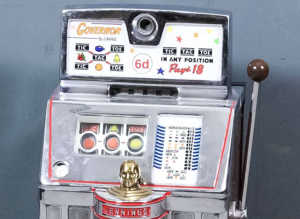 A 1950s American "Sixpence-in-the-Slot" "Governor - Tic-Tac-Toe" is an early one-armed bandit style gaming machine by Jennings & Company, Chicago, Illinois