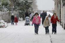 Children off school enjoying the snow in Beach Street, Sheerness