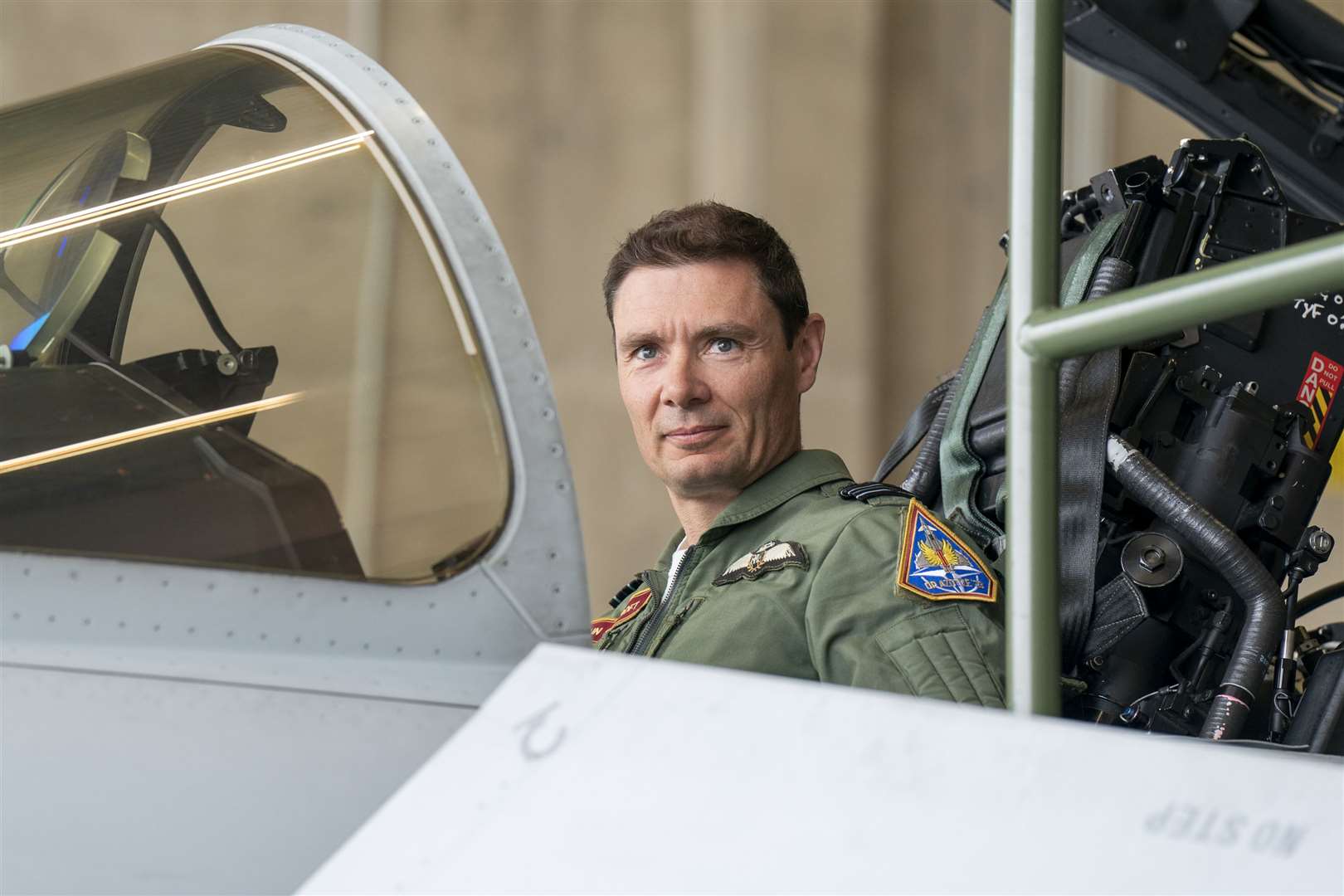 Officer Commanding 1 (Fighter) Squadron Wing Commander John Cockroft sits in the cockpit of a RAF Eurofighter Typhoon jet at the Amari airbase (Jane Barlow/PA)