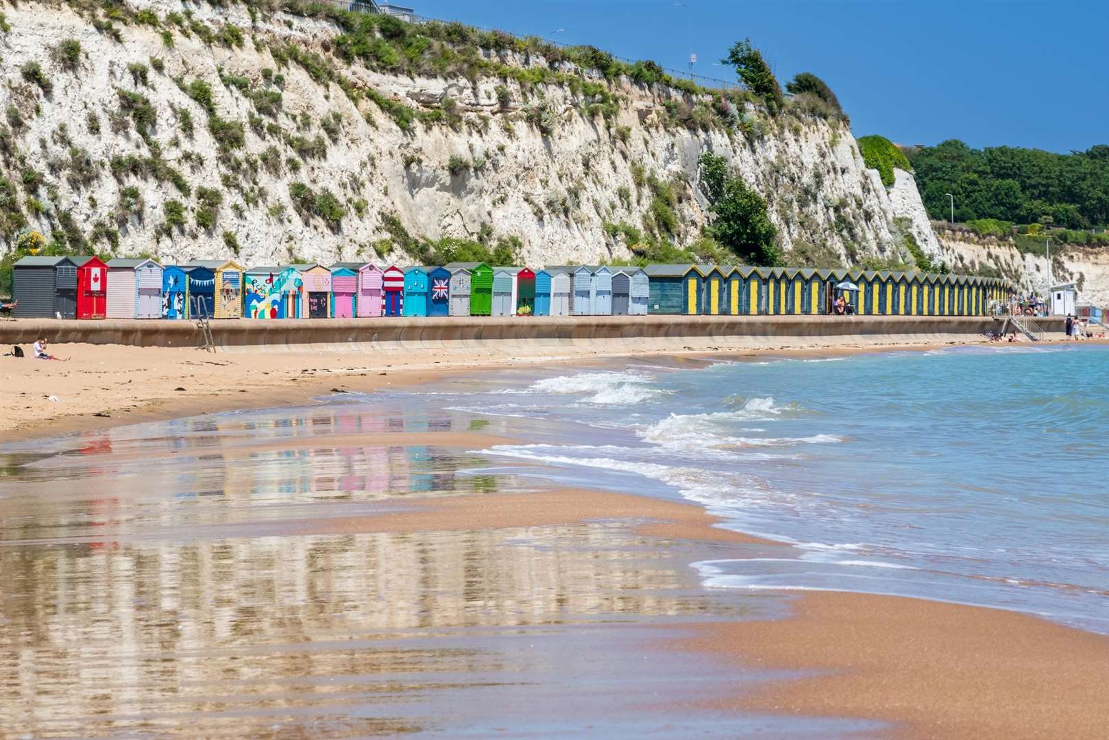 Beach huts and the sandy beach at Stone Bay, Broadstairs