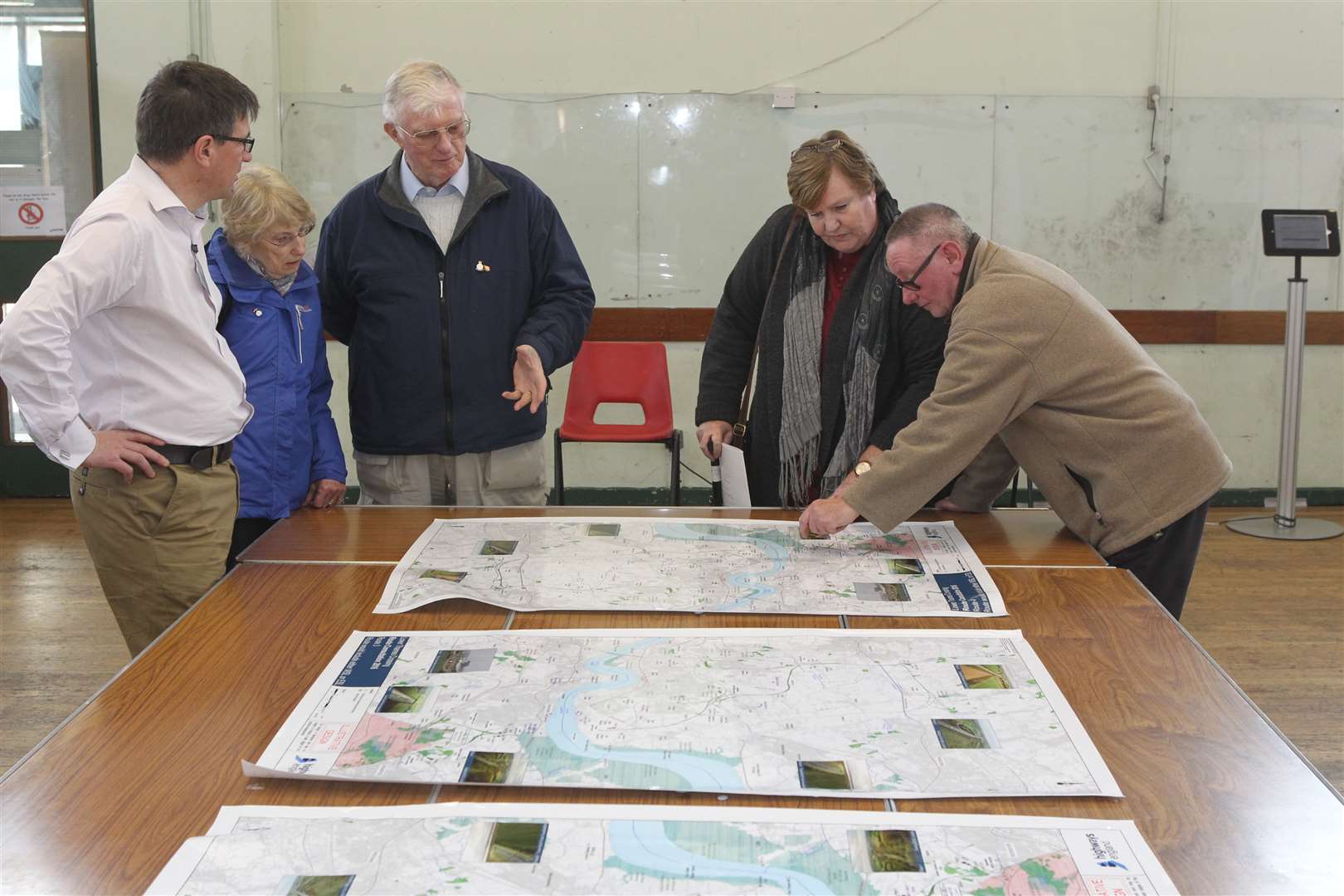 Visitors peruse Lower Thames Crossing plans at a public exhibition at Temple Hill Community Centre in Dartford.