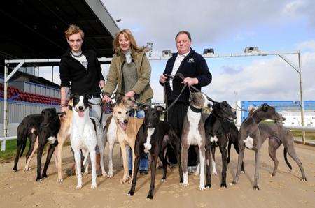 From left, Steve Parsons, Trudy Butler and Brian Booth, at Central Park Stadium, Sittingbourne, with 9 retired greyhounds from the kennels of the Sittingbourne Retired greyhound Trust. The trust is looking for new homes for these dogs
