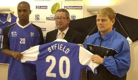 Byfield at Priestfield with chairman Paul Scally and manager Andy Hessenthaler. Picture: GAVIN CRAYFORD
