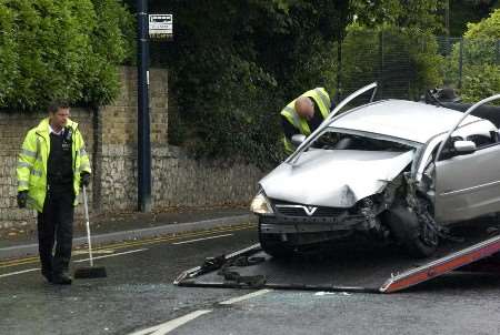 Firefighters had to remove the roof of the car to rescue the driver. Picture: JOHN WARDLEY