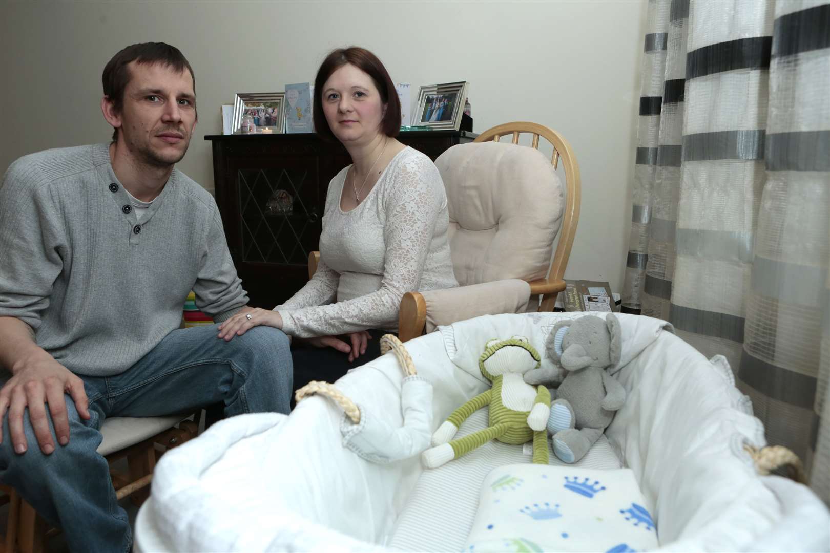 Dennis and Samantha with baby Gabriel's empty cot