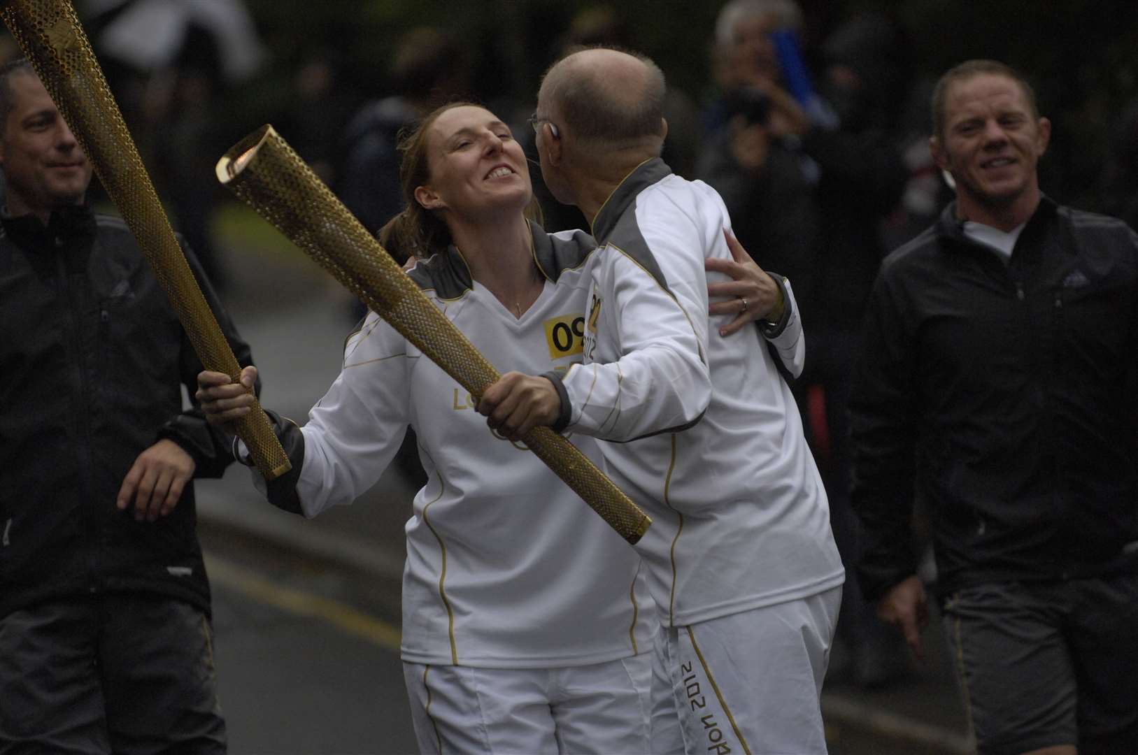 Cathy Graham and Wilfried Lemke exchange the flame and a kiss in Dover