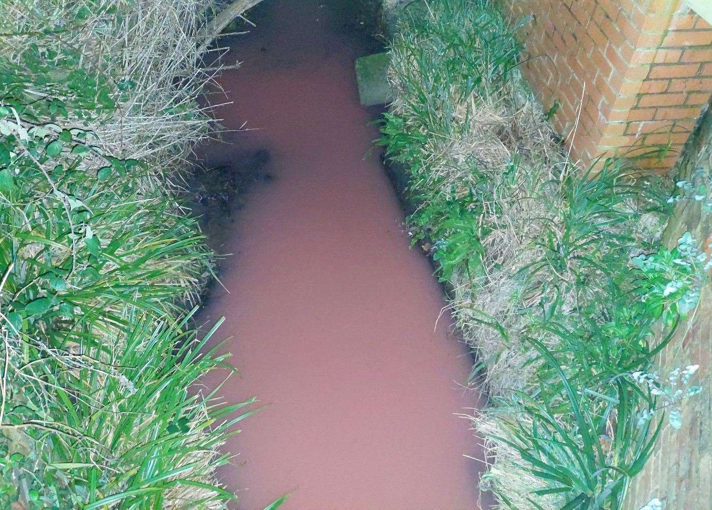 The bright pink streamwater seen in Ashford. Picture: KMG