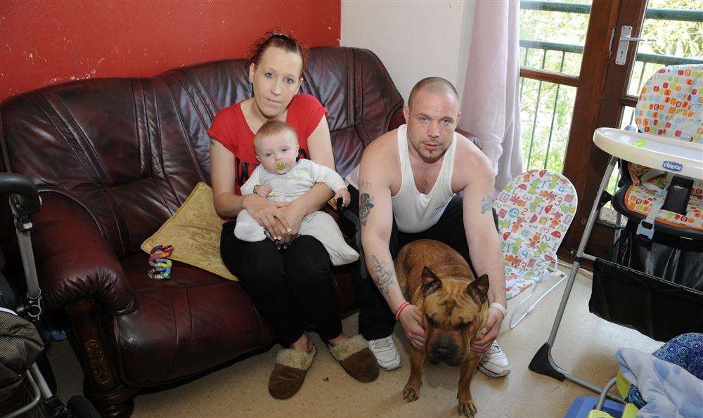Jade Thomas with son Aaron Jay Theobald Thomas (6 months), boyfriend Lee Theobald and Tia the dog in the living room