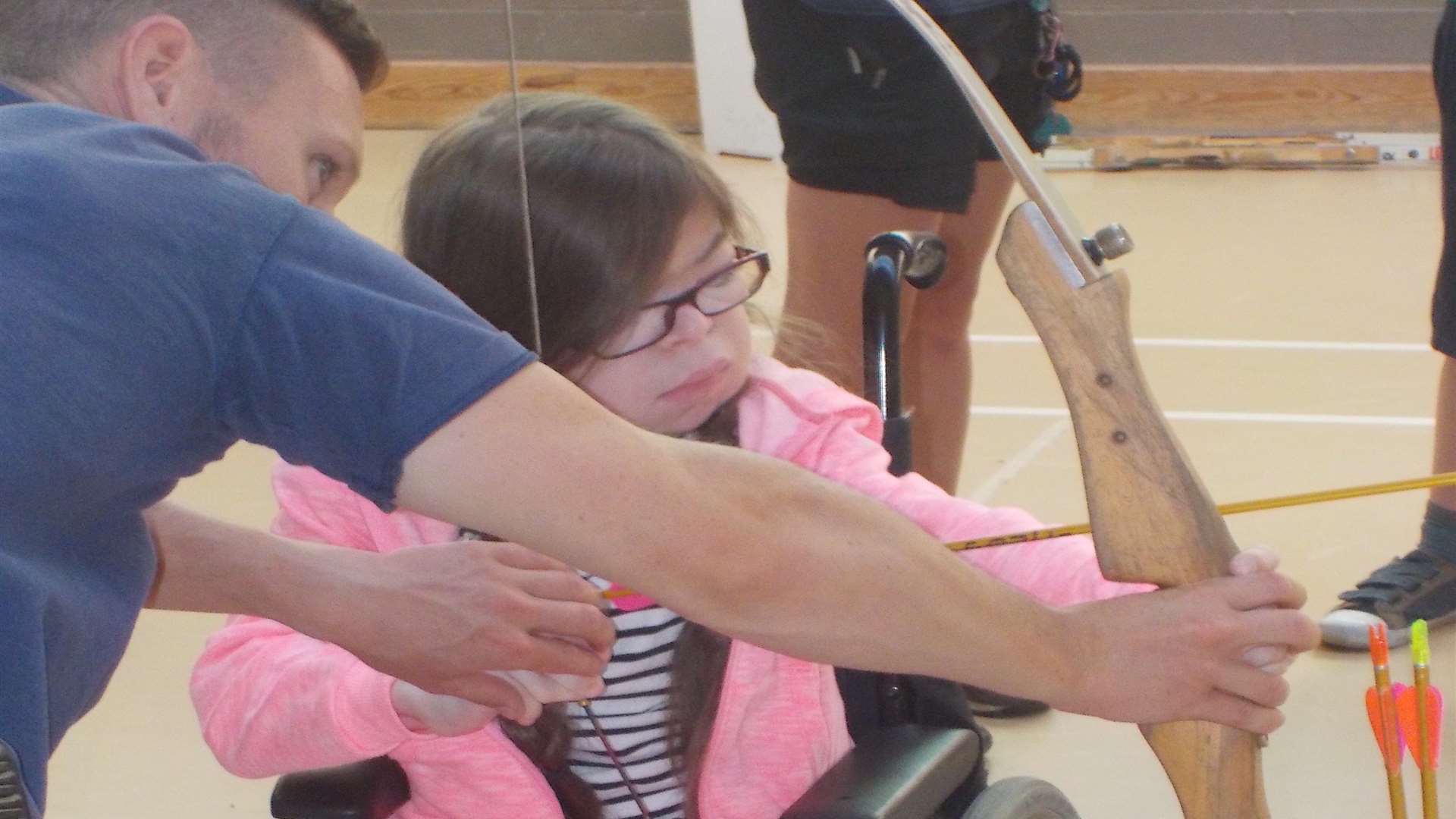 Holly Morant-Mills has a go at archery in her wheelchair