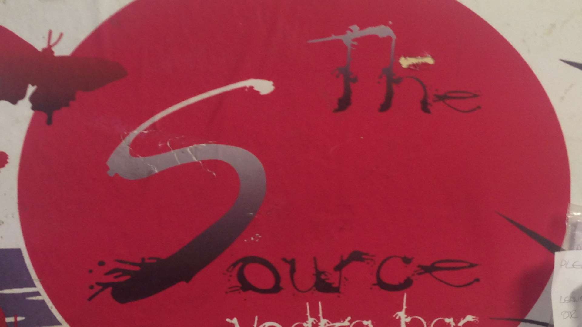The Source Bar sign