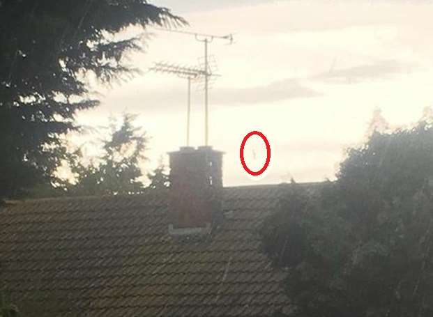 The mysterious figure above the rooftops