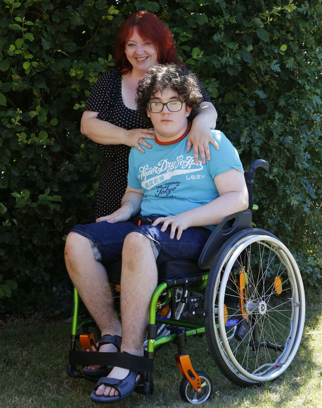 Owen was just 15, when he lost the ability to walk. He is pictured with his mum Shelley