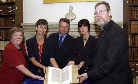 HISTORY LESSON: (left to right) Jill Kirk, Margaret Knight and Alan Sugden hand over the book to Cathedral librarian Sarah Gray and Canon Richard Marsh