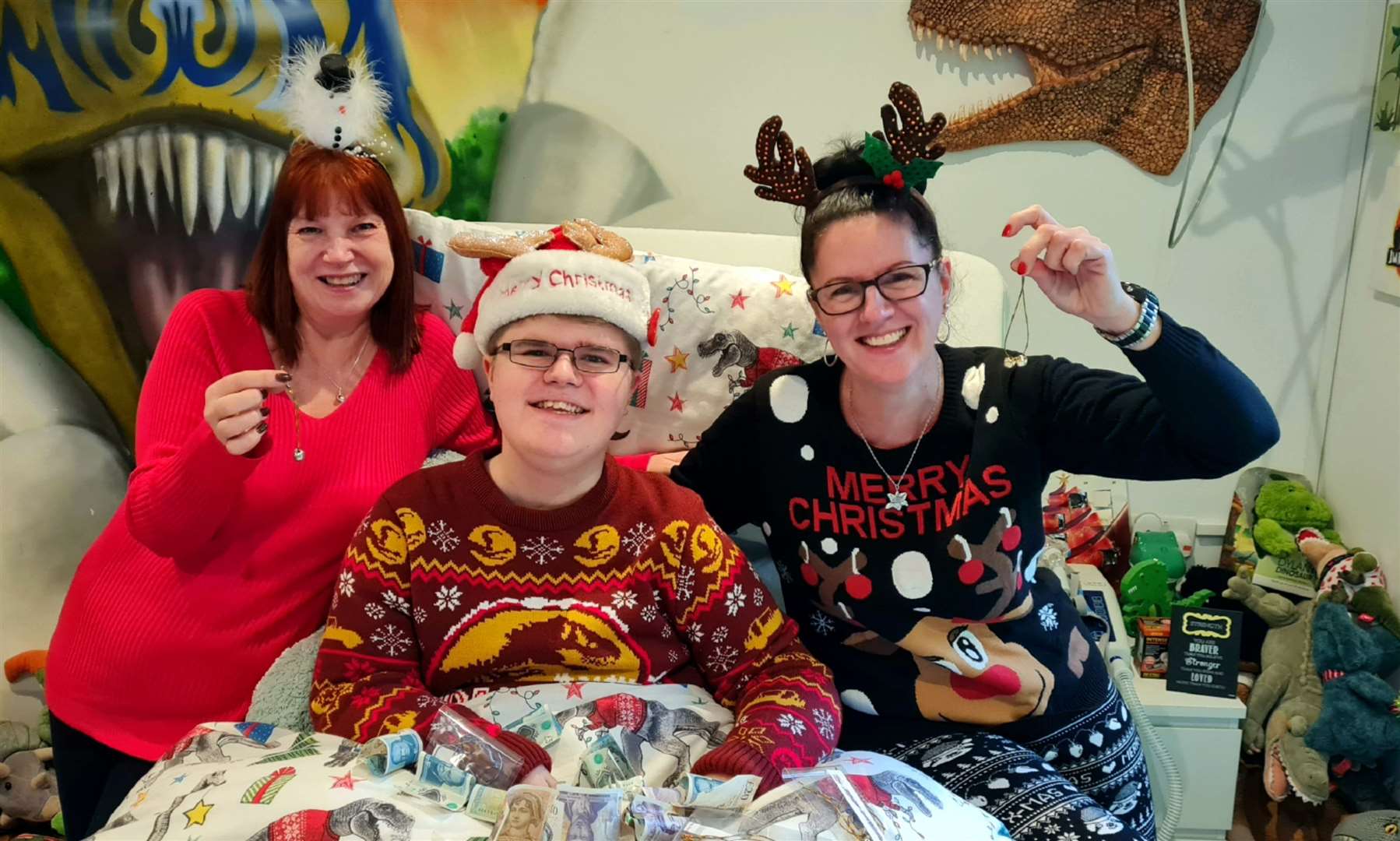 Lisa Edmonds and Denise Parris with Lisa's son Cameron and the jingle bells she's made for ellenor