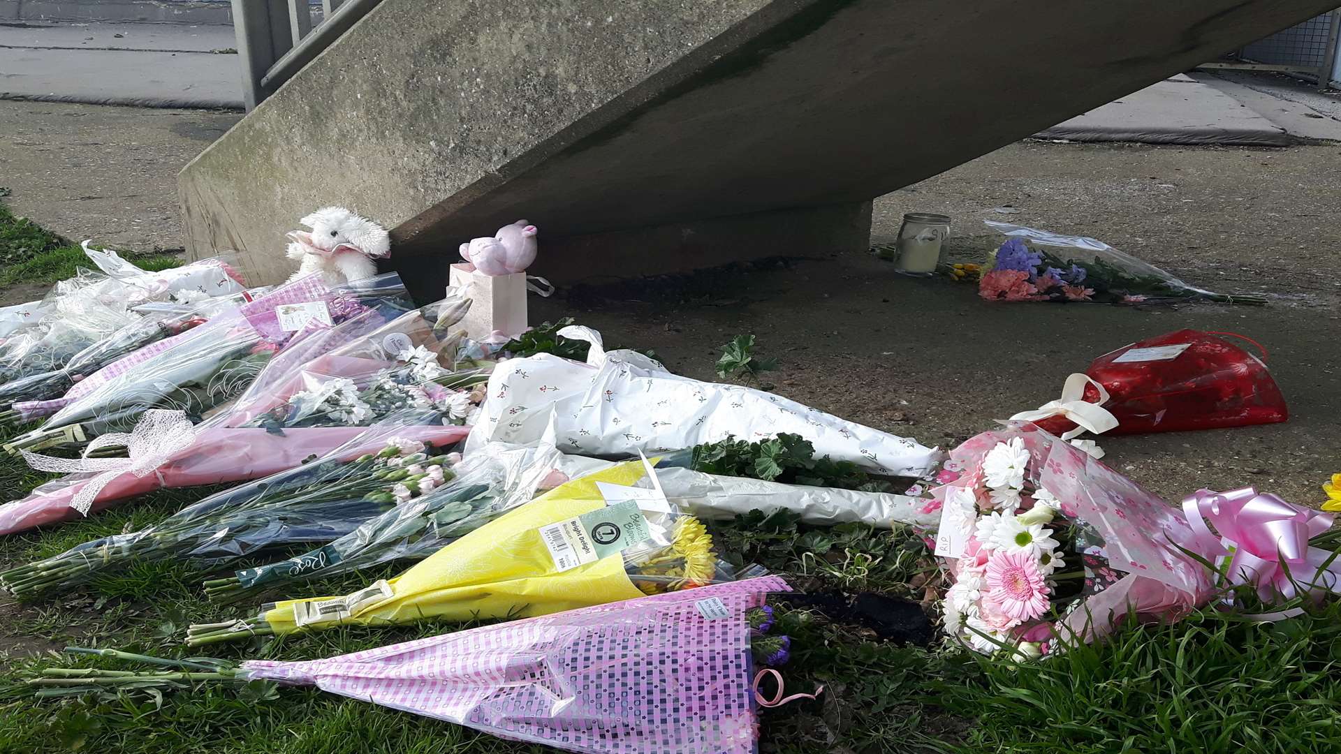 Flowers, candles and teddy bears were left where the body of the baby girl was discovered