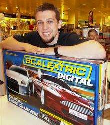 Paul McGrath, Hornby Sales Consultant, with the bumper Scalextric set donated as a prize for the KM Big Quiz.