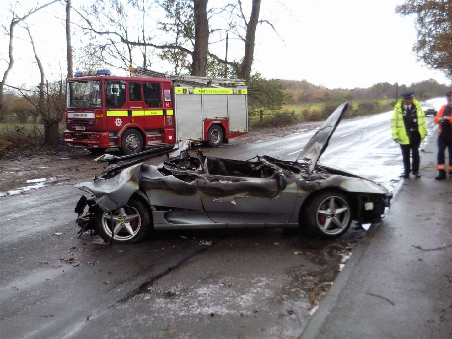 Fire crews at the scene after the Ferrari ploughed into the cafe. Picture: Ashford Borough Council