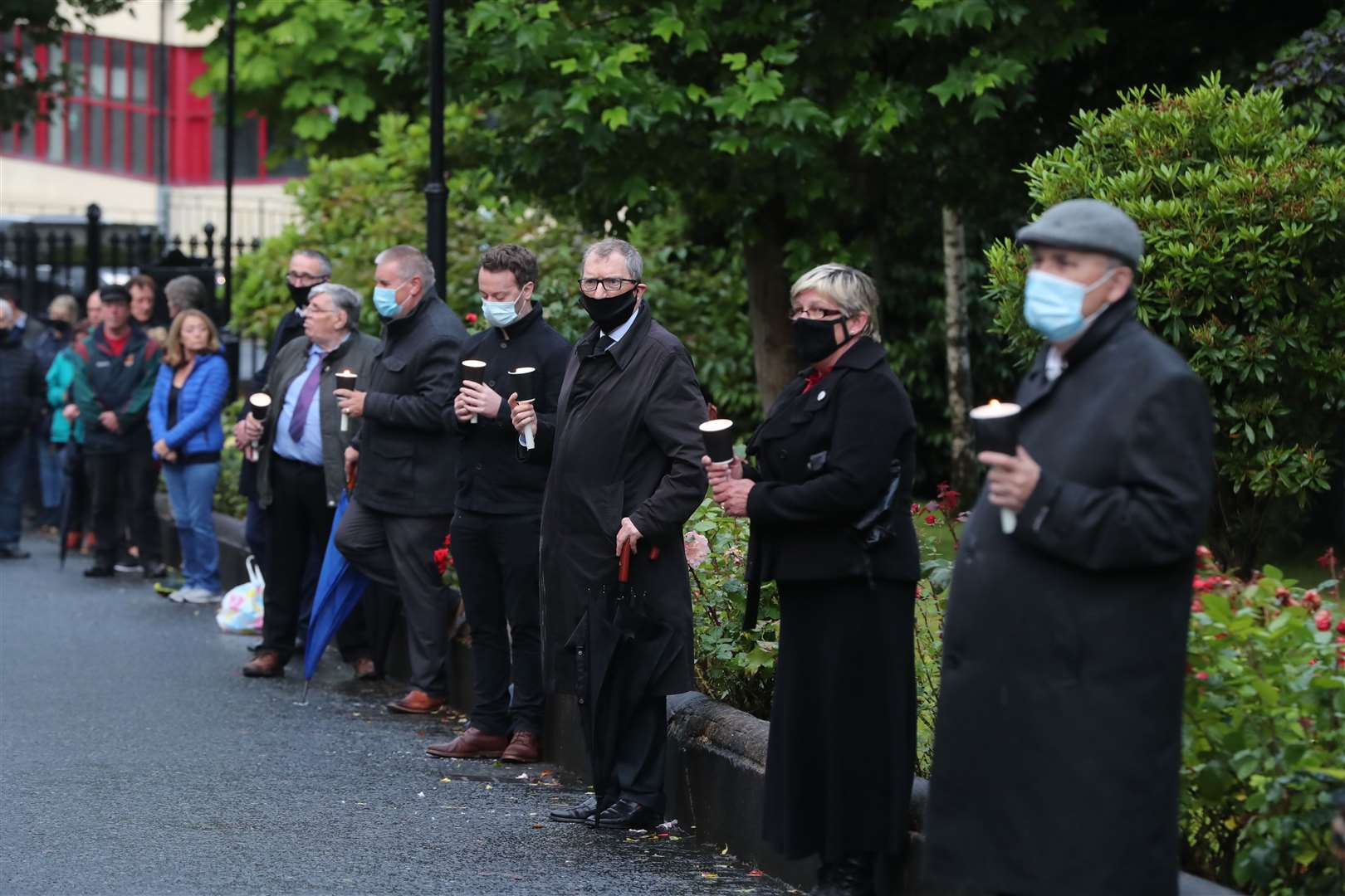 Family members and friends form a guard of honour (Niall Carson/PA)