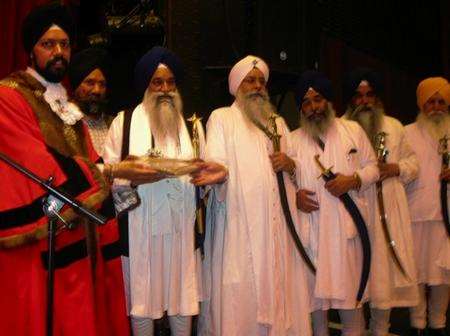 Mayor of Gravesham, Tanmanjeet Singh Dhesi, with five high priests from India who had travelled to watch him being sworn in as Mayor.