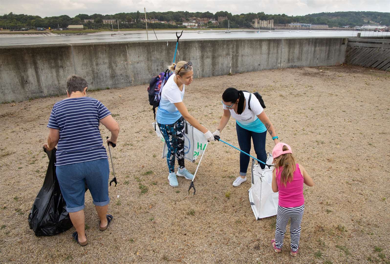 Around 20 volunteers helped clean the land around the marina (14702527)