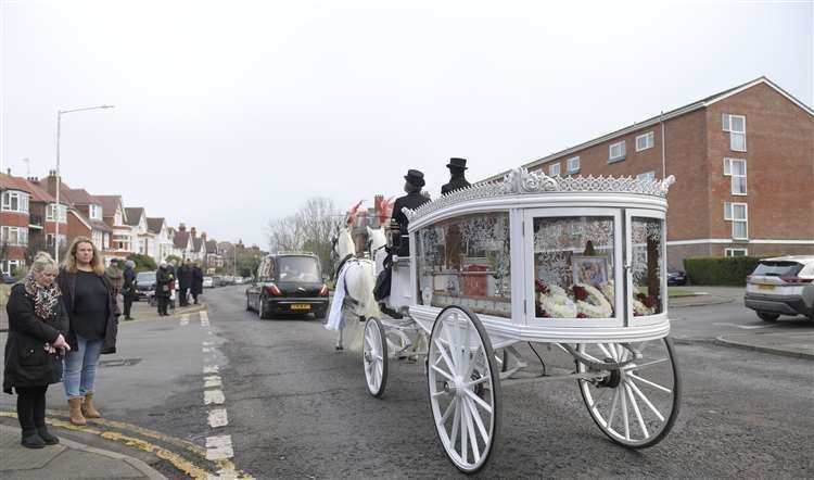 William's coffin is carried to The Church of St Mary and St Eanswythe, Folkestone, by a horse and carriage bearing the colours of his beloved Manchester United. Picture: Barry Goodwin