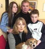 The Couzens family with their remaing dog Rosie. Picture: GARY BROWNE