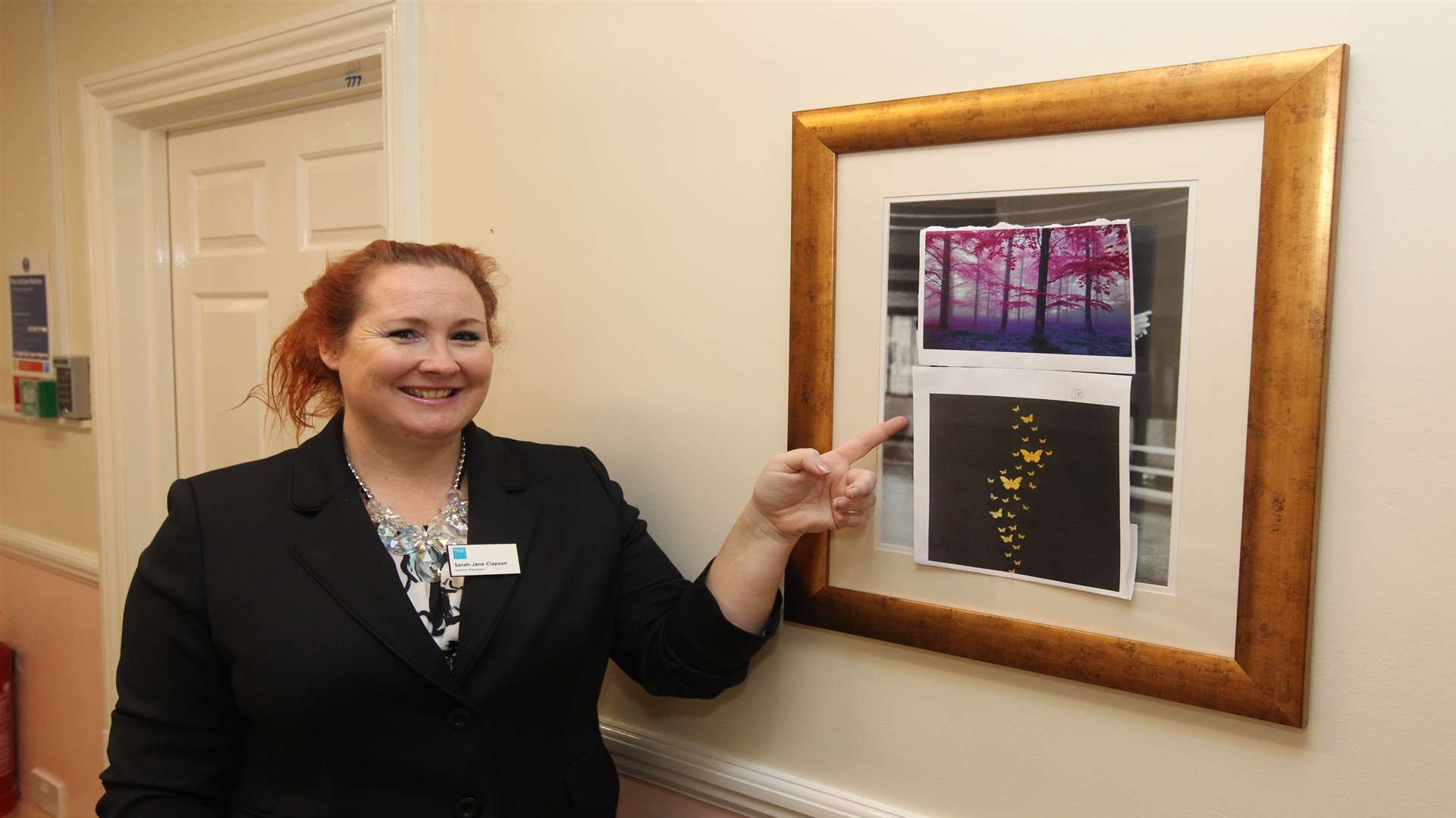 Sarah-Jane Clapson, MBA, Home Manager has pictures she has printed out showing future changes to the nursing home.