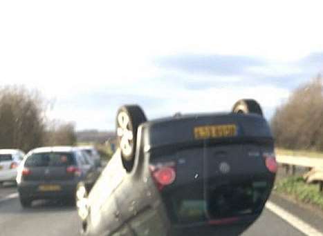 The overturned car. Pictures: Kent 999s