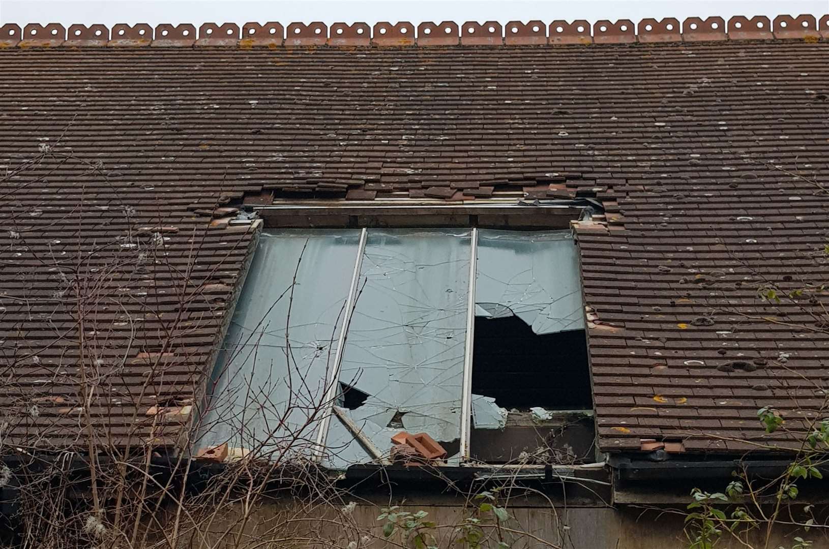 Broken window on the Kiln Court site, which closed in 2016