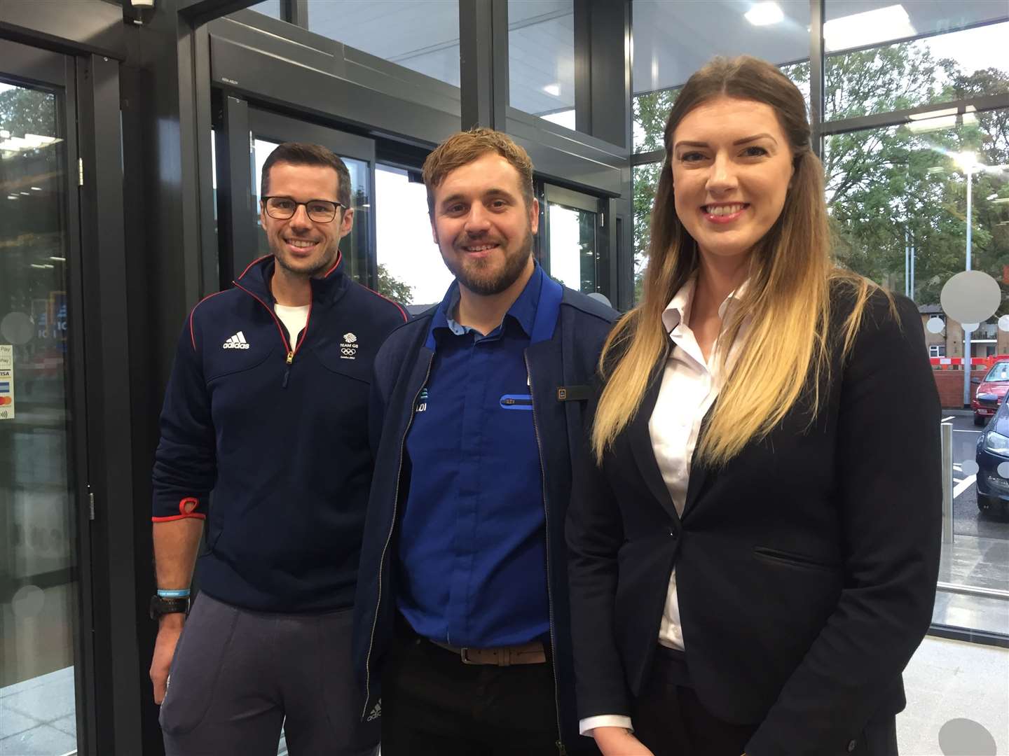 Olympic rower James Foad opened the Aldi in Hythe last month. He is pictured with Calum Morrison, store manager and Eve Grant, area manager