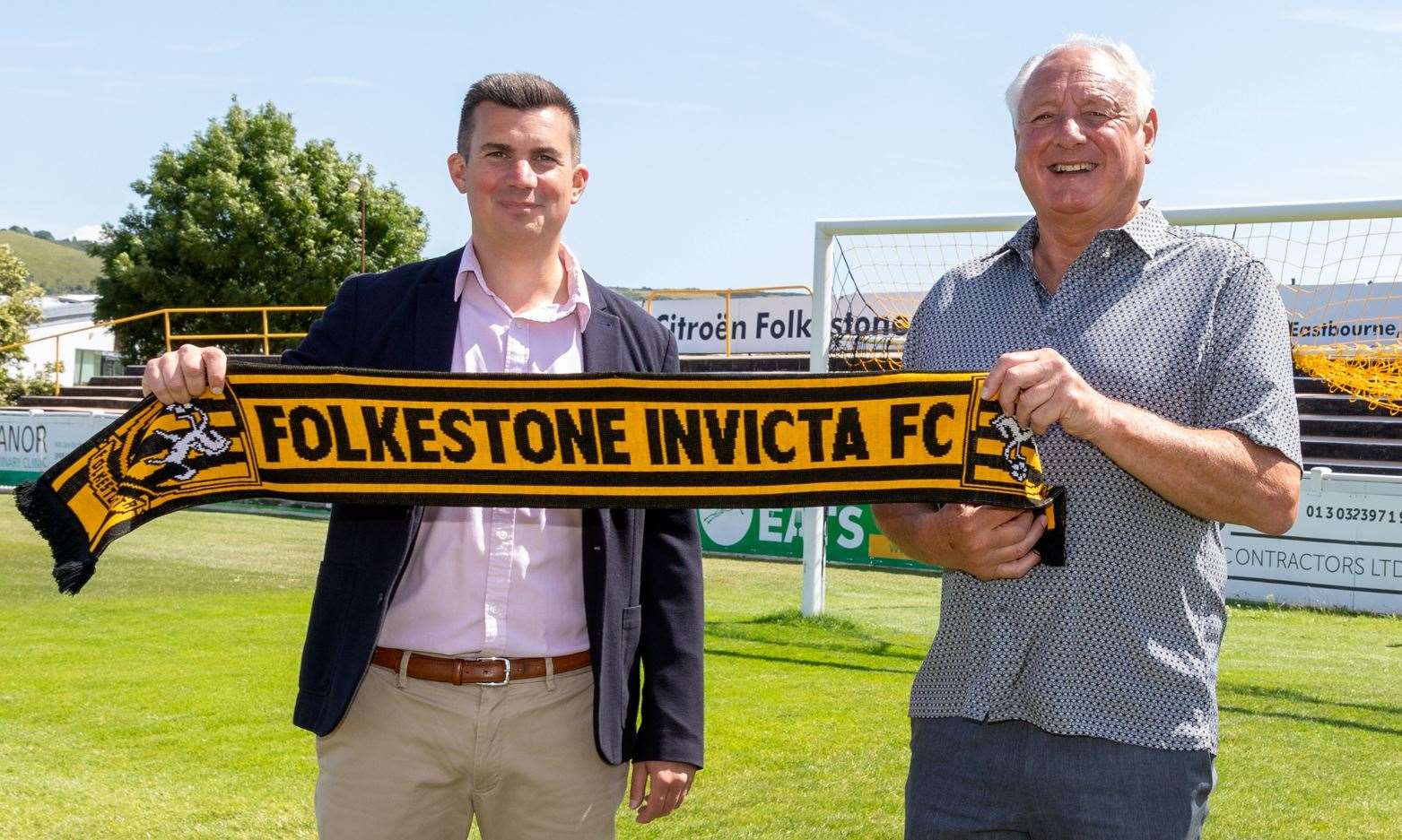 Neil Cugley, pictured with Invicta chairman Josh Healey, with still be involved at Folkestone in an ambassadorial role – despite stepping down as director of football